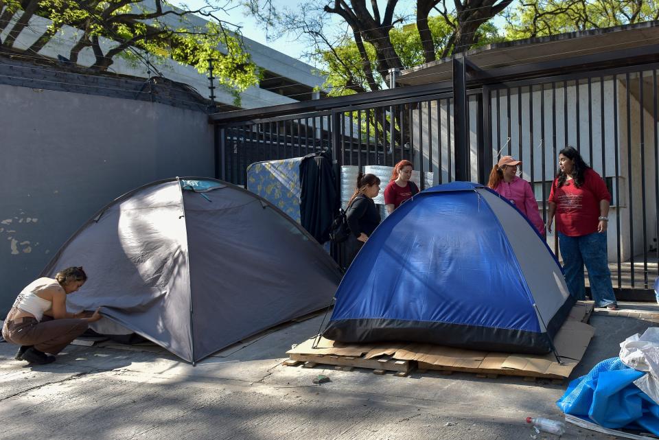 Women around tents in Buenos Aires, Argentina