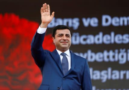 FILE PHOTO: The leader of Turkey's pro-Kurdish opposition Peoples' Democratic Party (HDP) Selahattin Demirtas greets his supporters during a rally in Istanbul, Turkey June 5, 2016. REUTERS/Osman Orsal/File Photo