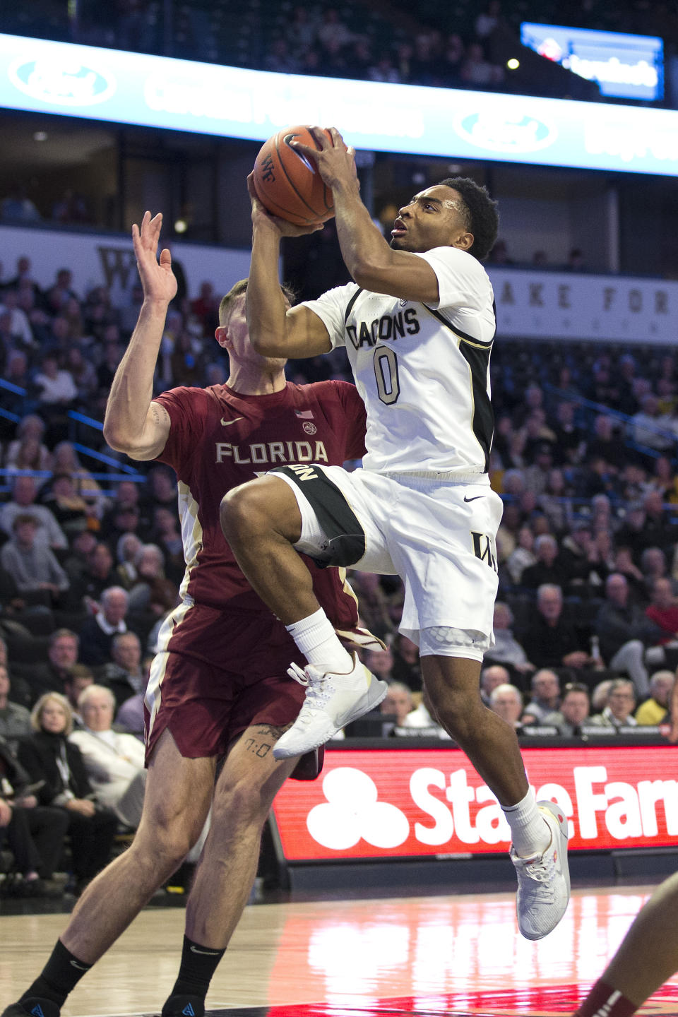 Wake Forest's Brandon Childress (0) shoots over Florida State's Dominik Olejniczak (15) in the first half of an NCAA college basketball game Wednesday, Jan. 8, 2020 in Winston-Salem, N.C. (AP Photo/Lynn Hey)
