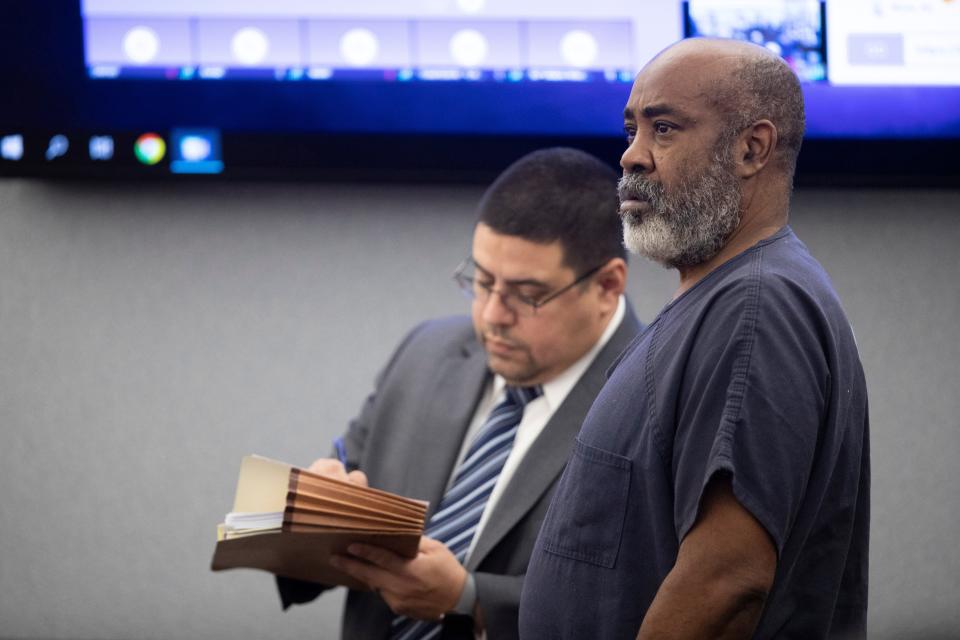 Defense attorney Robert Arroyo, left, stands by Duane "Keffe D" Davis as Davis makes an appearance in Clark County District Court on Nov. 7. A Las Vegas judge decided Davis can serve house arrest ahead of his criminal trial in June.