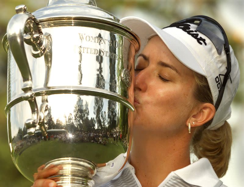 FILE PHOTO: Australian Karrie Webb kisses the trophy after winning the U.S. Women's Open at Pine Needles Golf Club in Southern Pines.