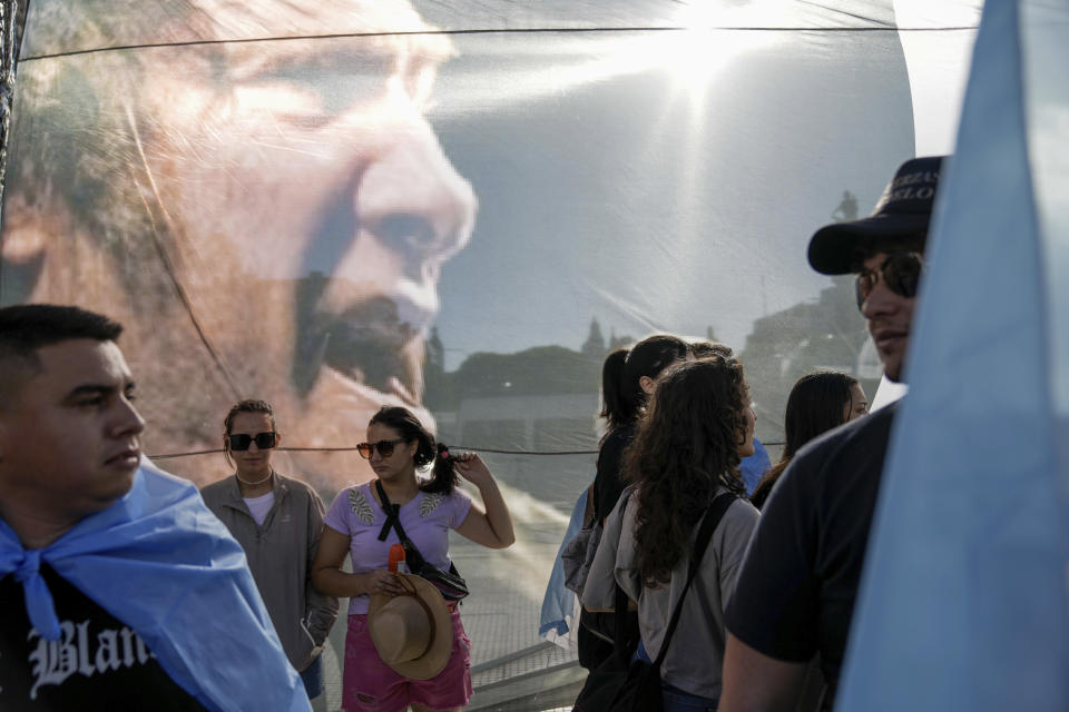 Supporters of Argentina's incoming President Javier Milei gather outside the Congress prior to his swearing-in ceremony in Buenos Aires, Argentina, Sunday, Dec. 10, 2023. (AP Photo/Rodrigo Abd)