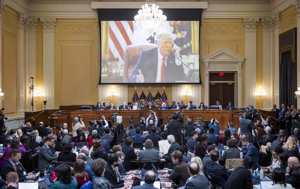 Looming large over proceedings. <a href="https://www.gettyimages.com/detail/news-photo/an-image-of-former-president-donald-trump-is-displayed-as-news-photo/1245731847?phrase=January%206&adppopup=true" rel="nofollow noopener" target="_blank" data-ylk="slk:Jim Lo Scalzo-Pool/Getty Images;elm:context_link;itc:0;sec:content-canvas" class="link ">Jim Lo Scalzo-Pool/Getty Images</a>