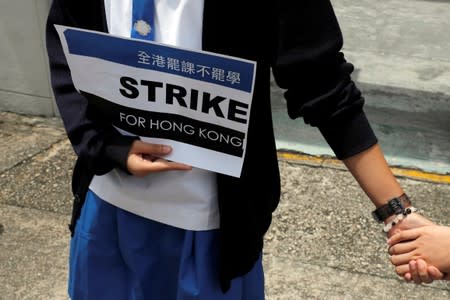 Secondary school students form a human chain against extradition bill in Hong Kong