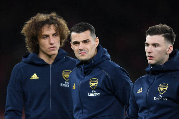 LONDON, ENGLAND - NOVEMBER 28: (L-R) David Luiz, Granit Xhaka and Kieran Tierney of Arsenal look on they line up ahead of the UEFA Europa League group F match between Arsenal FC and Eintracht Frankfurt at Emirates Stadium on November 28, 2019 in London, United Kingdom. (Photo by Shaun Botterill/Getty Images)