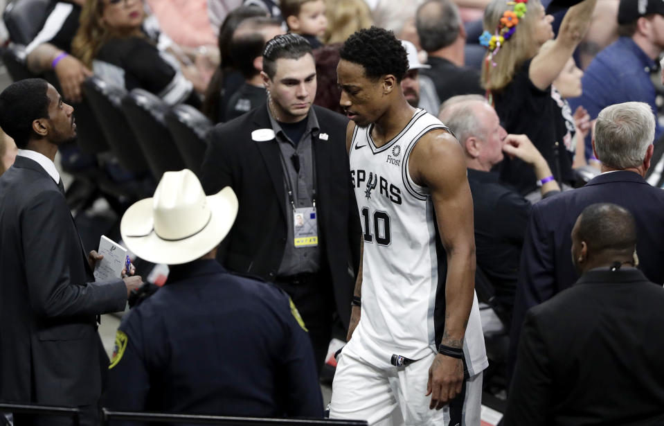 San Antonio Spurs guard DeMar DeRozan (10) leaves the court after he was ejected with five minutes remaining after arguing with an official over an offensive foul during the second half of Game 4 of an NBA basketball playoff series against the Denver Nuggets in San Antonio, Saturday, April 20, 2019. Denver won 117-103. (AP Photo/Eric Gay)