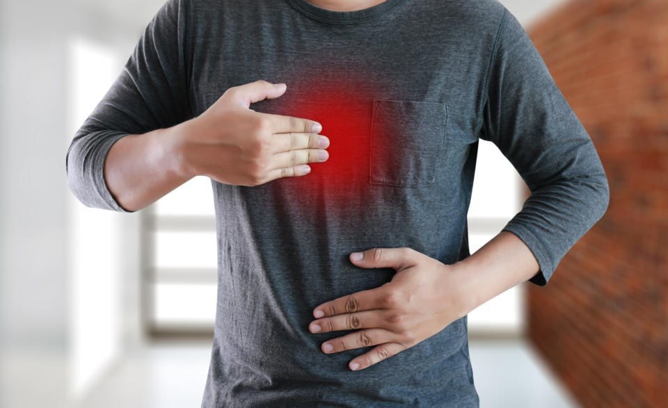 MAN with symptomatic acid reflux , suffering from acid reflux