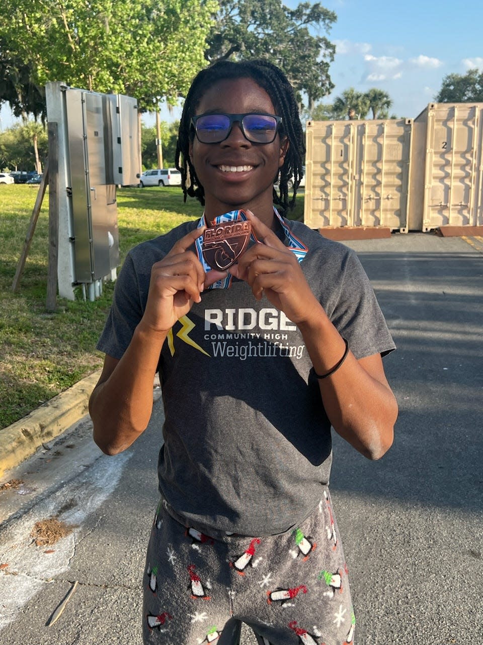 Ridge Community's A-Jay Saint Louis took third in the boys state weightlifting championships Friday at the RP Funding Center.