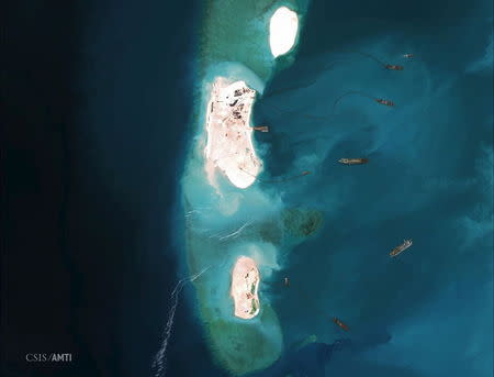 Dredgers reinforce a site being constructed on the westernmost part of Mischief Reef, located 216 km (135 miles) west of the Philippine island of Palawan, in this Center for Strategic and International Studies (CSIS) Asia Maritime Transparency Initiative satellite image taken on March 16, 2015 and released to Reuters on April 9, 2015. REUTERS/CSIS's Asia Maritime Transparency Initiative/Digital Globe/Handout