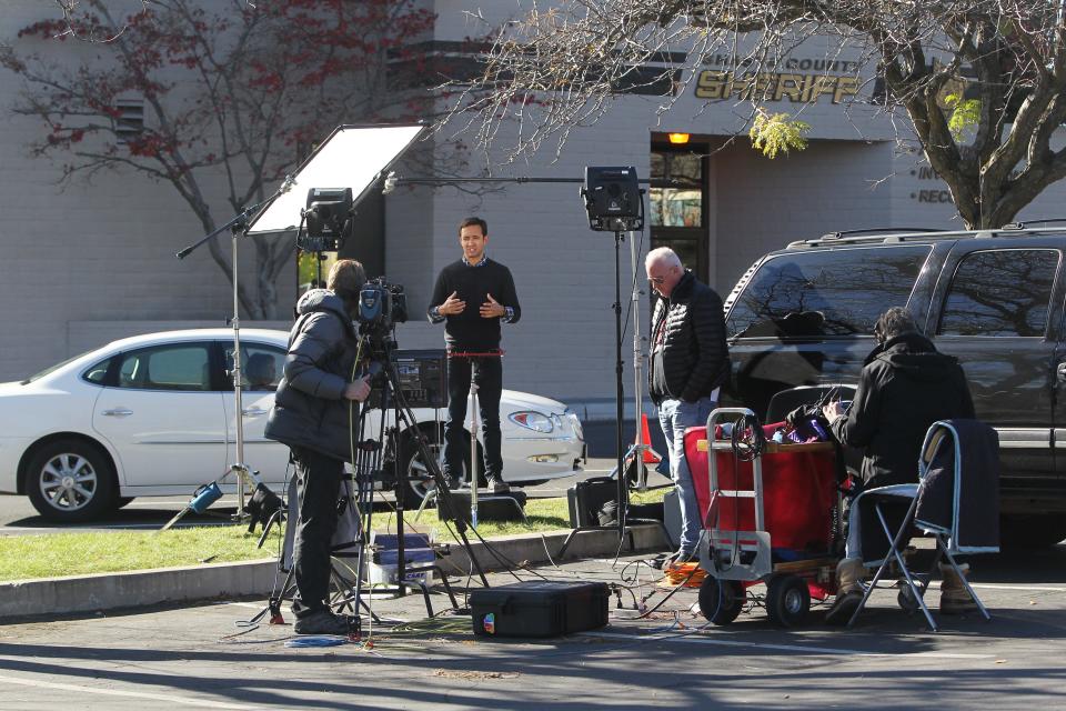 A team from NBC News works in front of the Shasta County Sheriff's Office Thursday in Redding.