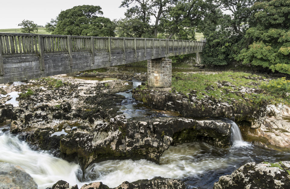 Pedestrian bridge over Linton Falls, near Grassington, Yorkshire