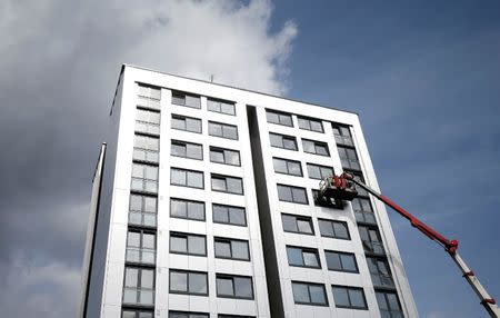 Cladding is removed from the side of Whitebean Court in Salford, Manchester, Britain June 26, 2017. REUTERS/Andrew Yates