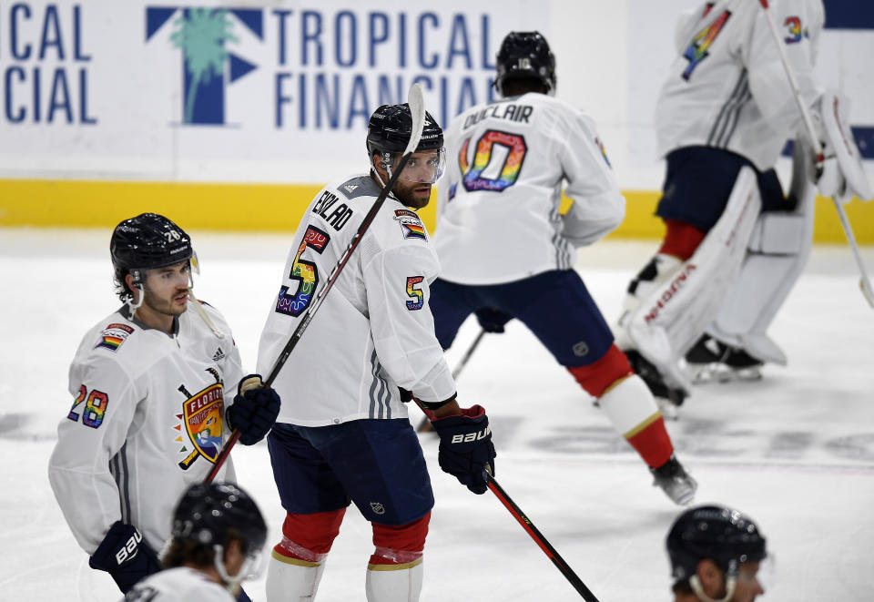 Florida Panthers defenseman Aaron Ekblad (5) warm up while wearing a Pride Night jersey before playing the Toronto Maple Leafs, Thursday, March 23, 2023, in Sunrise, Fla. (AP Photo/Michael Laughlin)