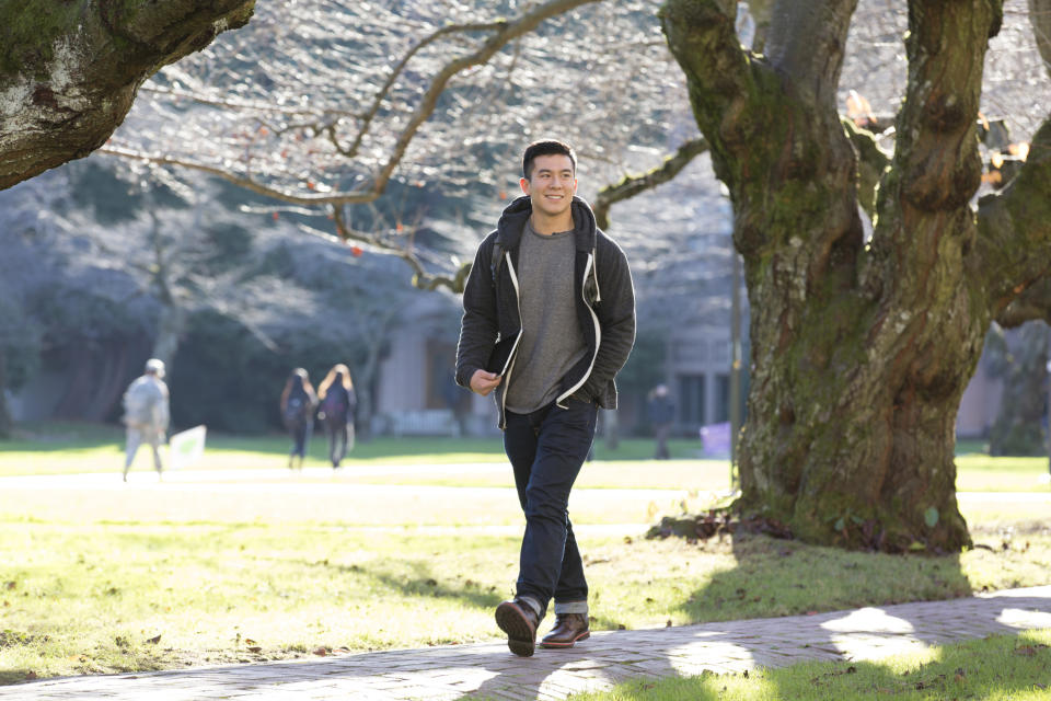 Smiling man walking alone