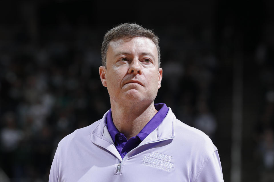 James Madison coach Mark Byington watches during an NCAA college basketball game against Michigan State, Monday, Nov. 6, 2023, in East Lansing, Mich. (AP Photo/Al Goldis)