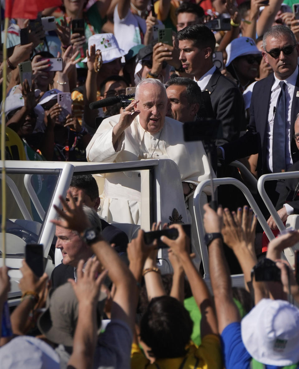 Pope Francis arrives at Lisbon's Parque Eduardo VII to preside over a 'Via Crucis' (Way of the Cross) with young people participating into Sunday's 37th World Youth Day in the Portuguese capital, Friday, Aug. 4, 2023. Francis is in Portugal through the weekend to preside over the jamboree that St. John Paul II launched in the 1980s to encourage young Catholics in their faith. (AP Photo/Armando Franca)