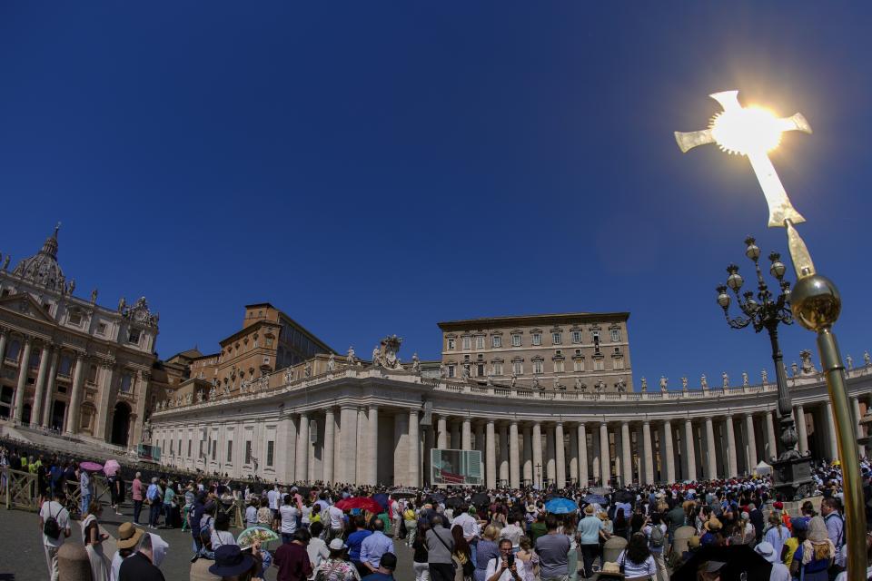 People gather in St.Peter's Square, at the Vatican, as Pope Francis delivers his blessing as he recites the Regina Coeli noon prayer from the window of his studio, Sunday, April 14, 2024. Pope Francis urged Iran and Israel in his Sunday's Angelus prayer to avoid new actions that could spark "a spiral of violence" and risked dragging the Middle East deeper into conflict. (AP Photo/Andrew Medichini)