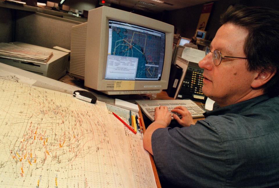 FILE - In this Tuesday, Feb. 1, 2000 file photo, a meteorologist uses the Northwest Airlines' Turbulence Plot System software, to track areas of turbulent air over the Pacific at the System Operations Center in Minneapolis. More pollution is likely to mean bumpier flights for trans-Atlantic travelers, researchers say in a report published Monday April 8 2013, predicting increased turbulence over the north Atlantic as carbon dioxide levels rise. (AP Photo/Dawn Villella, File)