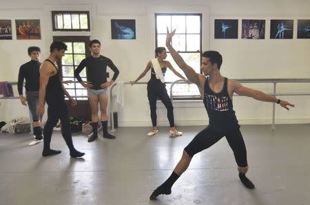 Jorge Sanchez and half dozen dancers from the National Ballet of Cuba who defected after a performance in Puerto Rico rehearse for an upcoming performance shortly before a news conference in Miami, Florida June 10, 2014. REUTERS/Gaston De Cardenas