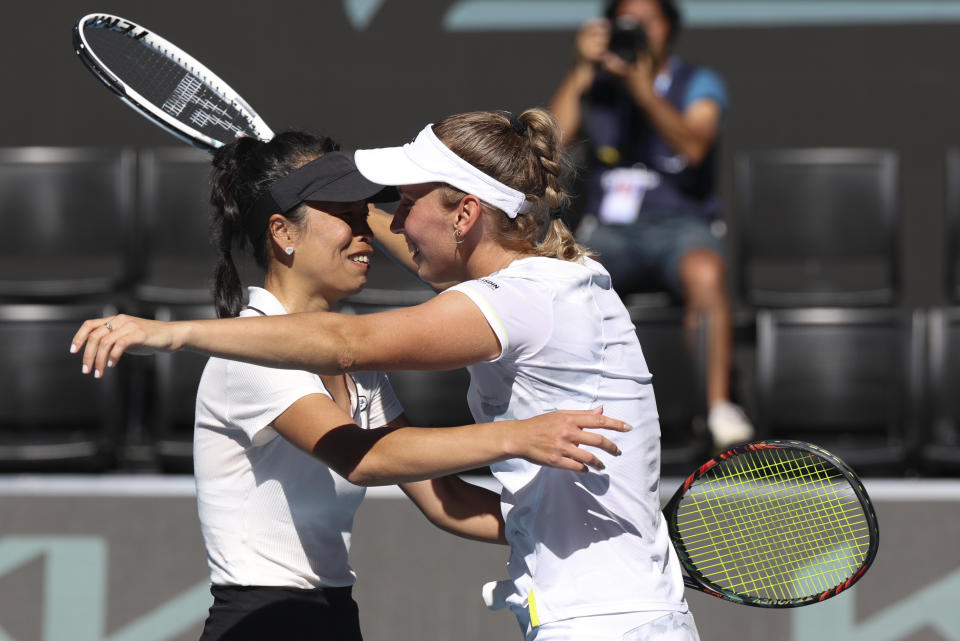 Hsieh Su-Wei, left, of Taiwan and Elise Mertens of Belgium celebrate after defeating Jelena Ostapenko of Latvia and Lyudmyla Kichenok of Ukraine in the women's doubles final at the Australian Open tennis championships at Melbourne Park, in Melbourne, Australia, Sunday, Jan. 28, 2024. (AP Photo/Asanka Brendon Ratnayake)