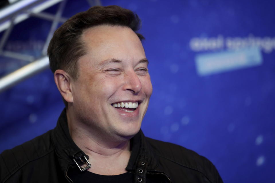 SpaceX owner and Tesla CEO Elon Musk arrives on the red carpet for the Axel Springer media award, in Berlin, Germany, Tuesday, Dec. 1, 2020. (Hannibal Hanschke/Pool via AP)