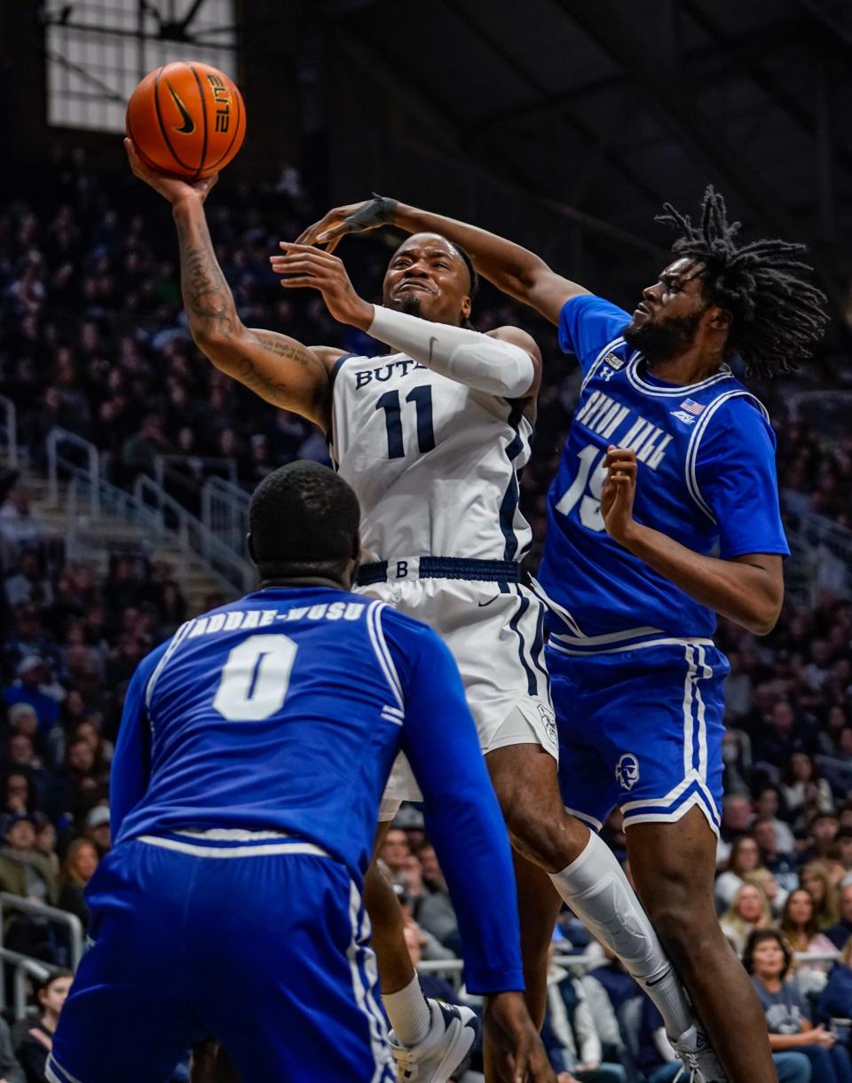 Butler Bulldogs forward Jahmyl Telfort (11) battles Seton Hall Pirates guard Dre Davis (14) for the ball during a game between the Butler Bulldogs and the Seton Hall Pirates and the Seton Hall Pirates on Saturday, Jan. 13, 2024 at Hinkle Fieldhouse in Indianapolis.