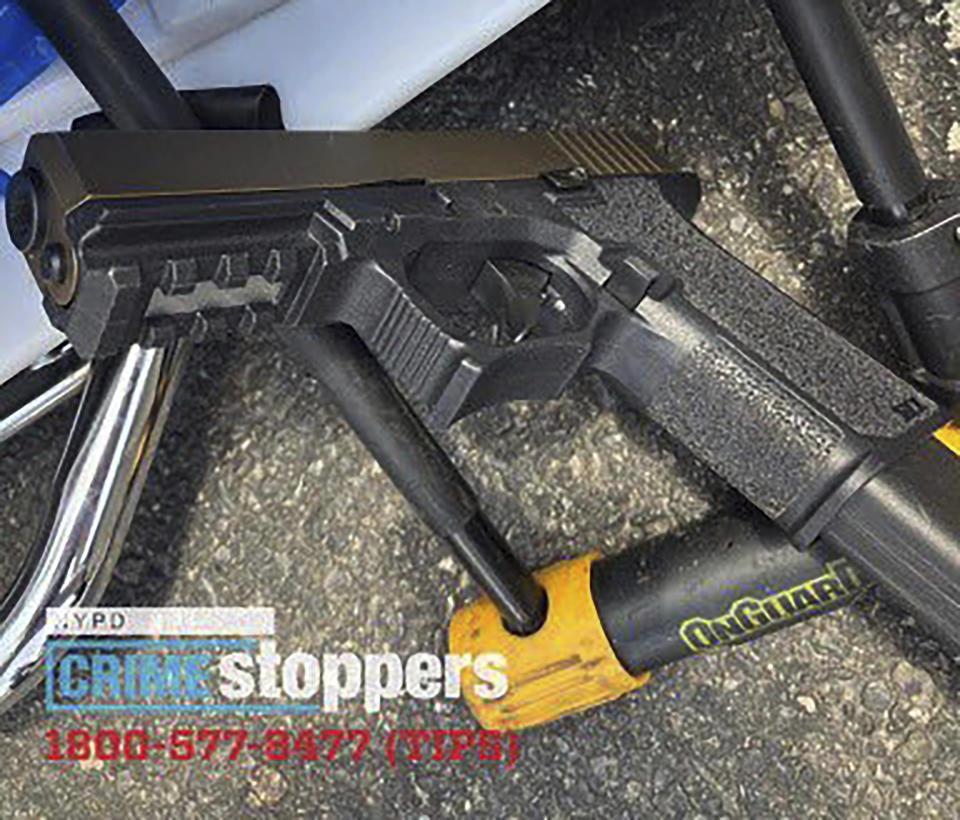 This photo, released by the New York City Police Department, Saturday, July 8, 2023, shows a gun recovered at the scene of a shooting, in the Queens borough of New York. An 86-year-old New York City man was fatally shot and at least two others were seriously wounded by a man on a scooter who police say was shooting randomly at cars and pedestrians in Queens on Saturday. (New York City Police Department via AP)