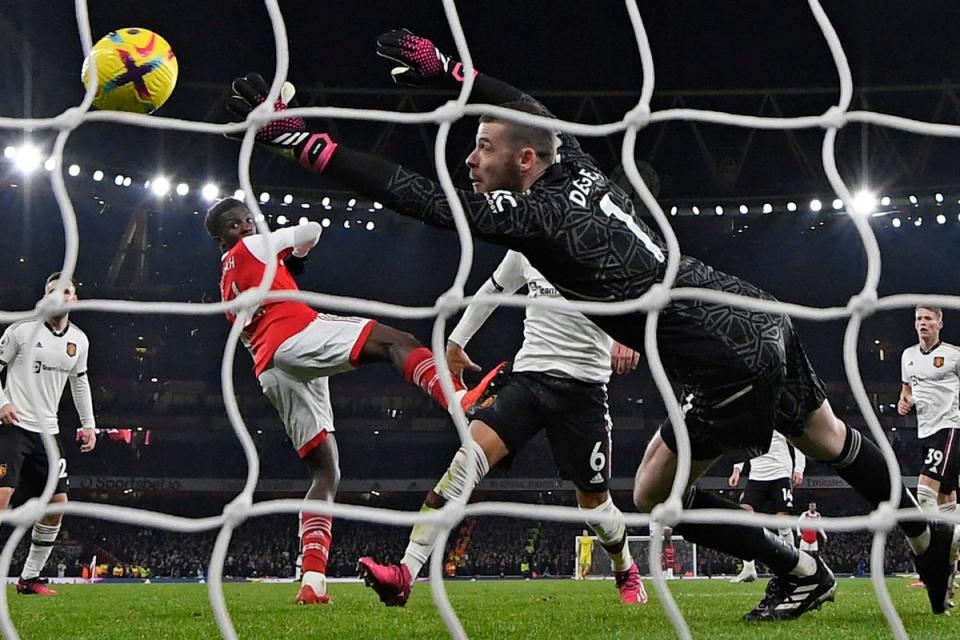 Arsenal's English striker Eddie Nketiah (2L) shoots past Manchester United's Spanish goalkeeper David de Gea from close range to score their third goal during the English Premier League football match between Arsenal and Manchester United (AFP via Getty Images)