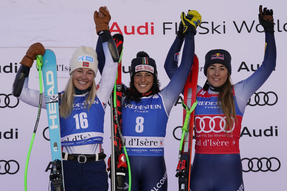 From left, second placed Norway's Kajsa Vickhoff Lie, the winner Italy's Federica Brignone and third placed Italy's Sofia Goggia celebrate after an alpine ski, women's World Cup Super G race, in Val d'Isere, France, Sunday, Dec. 17, 2023. (AP Photo/Giovanni Auletta)