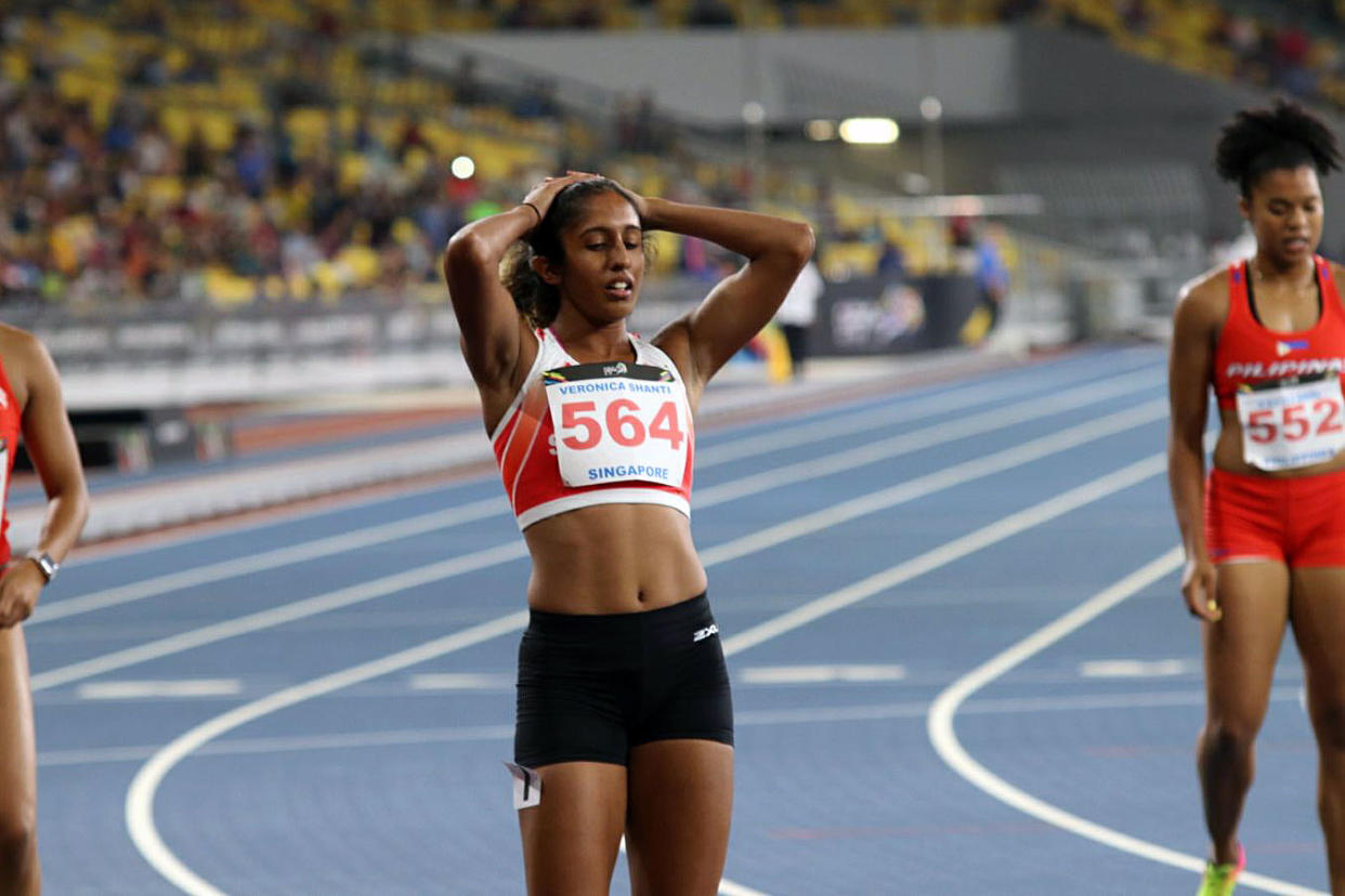 Singapore’s Shanti Pereira looking disappointed after finishing third in the 200m women’s race at the Bukit Jalil National Stadium on Wednesday (23 August) night. (PHOTO: Hannah Teoh / Yahoo News Singapore)