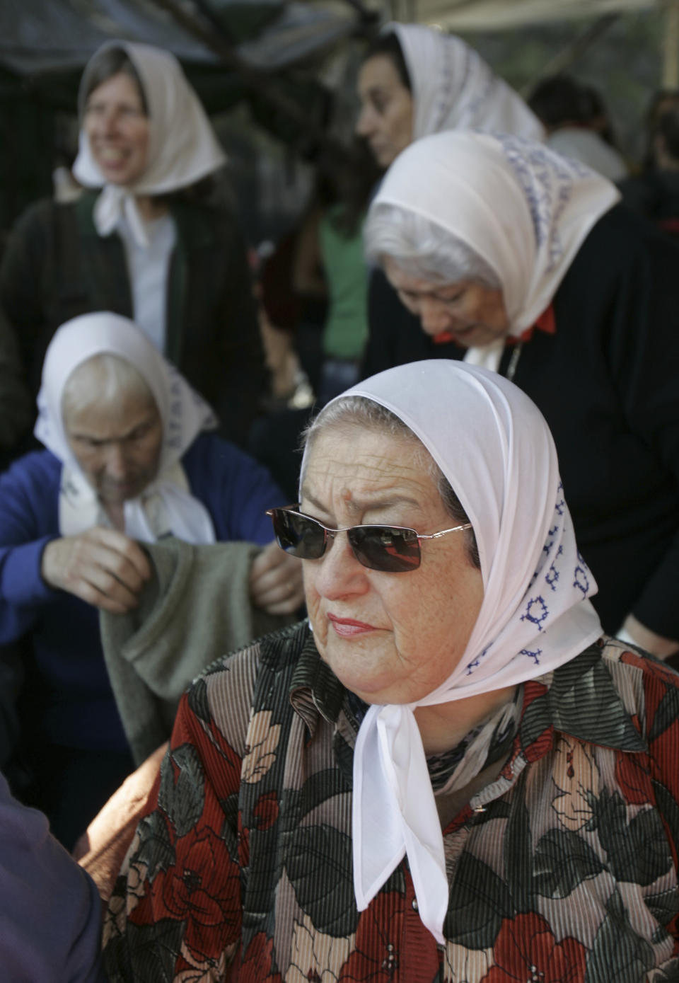 FILE - Hebe de Bonafini, leader of the Mothers of Plaza de Mayo, stands on stage during an event marking the 30th anniversary of the organization's first protest demanding the return of their disappeared children and relatives in Buenos Aires, Monday, April 30, 2007. Bonafini's two sons were arrested and disappeared. (AP Photo/Natacha Pisarenko, File)