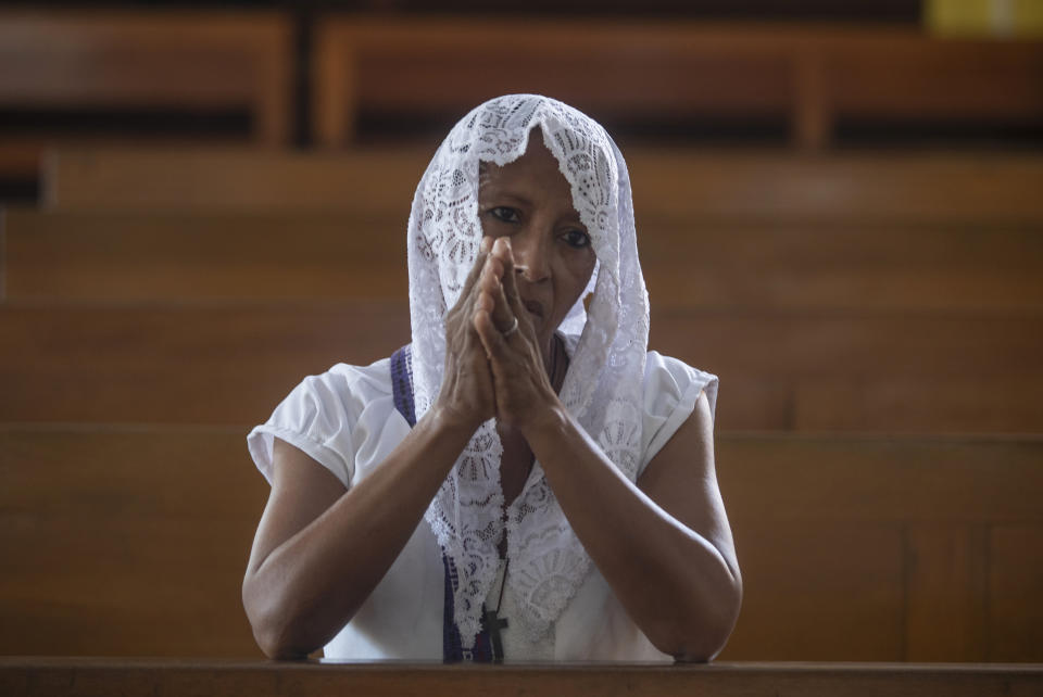 A Catholic woman attends Sunday's mass at the Metropolitan Cathedral in Managua, Nicaragua, Sunday, Feb. 12, 2023. Pope Francis expressed sadness and worry at the news that Bishop Roland Alvarez, an outspoken critic of the Nicaraguan government, had been sentenced to 26 years in prison. (AP Photo/Inti Ocon)