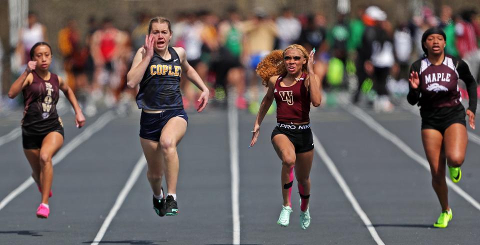 Walsh Jesuit senior Alexis Steward, right center, leads Copley's Kami Ayoup, left center, Stow's Sidney Shepert, left, and Maple Heights' Cassidy Clements during the 100 meters Saturday at the Nordonia Knight Relays
