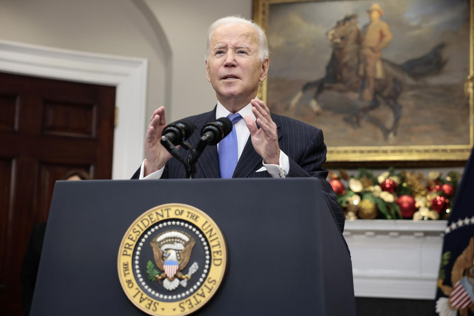 President Biden speaks about the Omicron variant at a lectern at at the White House.