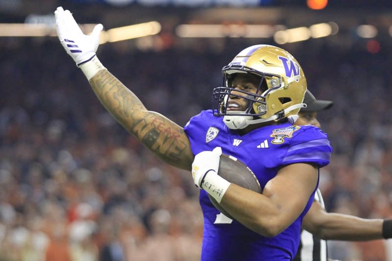 Washington Huskies running back Dillon Johnson celebrates after scoring in the first quarter against the Texas Longhorns in the Sugar Bowl on Monday in Caesars Superdome in New Orleans. Photo by AJ Sisco/UPI