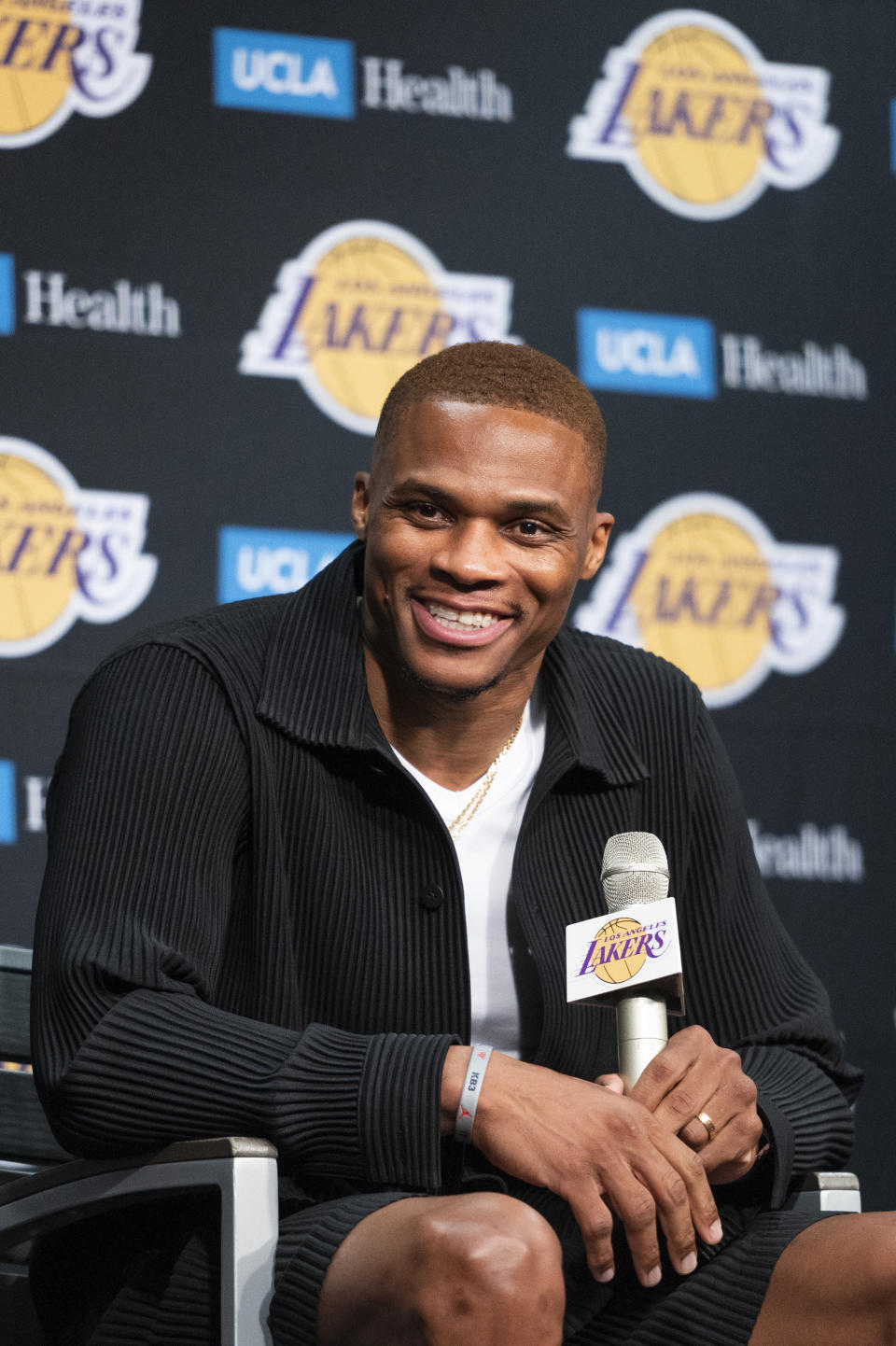 Los Angeles Lakers guard Russell Westbrook smiles during an introductory NBA basketball news conference in Los Angeles, Tuesday, Aug. 10, 2021. (AP Photo/Kyusung Gong)