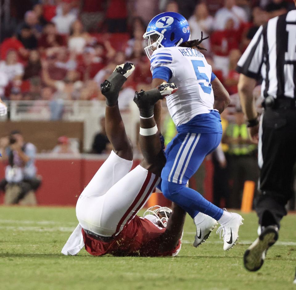 Brigham Young Cougars cornerback Eddie Heckard (5) sacks Arkansas Razorbacks quarterback KJ Jefferson (1) near the end of the game at Razorback Stadium in Fayetteville on Saturday, Sept. 16, 2023. BYU won 38-31. | Jeffrey D. Allred, Deseret News