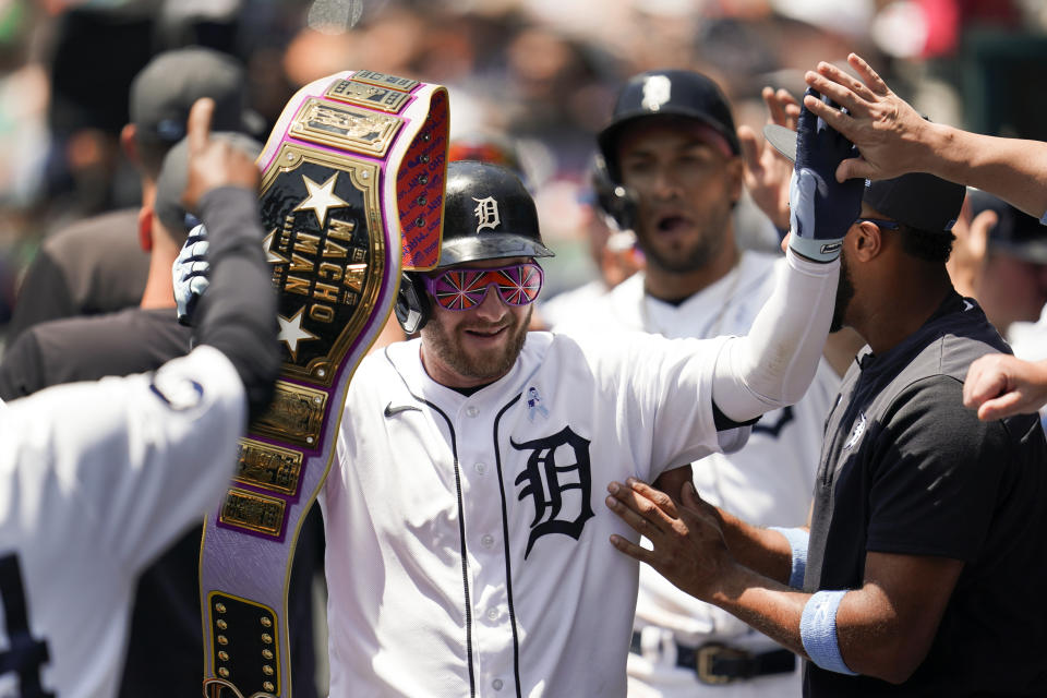 Detroit Tigers' Robbie Grossman celebrates his three-run home run against the Texas Rangers in the first inning of a baseball game in Detroit, Sunday, June 19, 2022. (AP Photo/Paul Sancya)