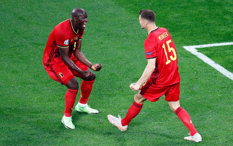 Belgium's forward Romelu Lukaku (L) celebrates with Belgium's defender Thomas Meunier after socring his team's first goal during the UEFA EURO 2020 Group B football match between Belgium and Russia at the Saint Petersburg Stadium in Saint Petersburg on June 12, 2021 - ANTON VAGANOV/POOL/AFP via Getty Images