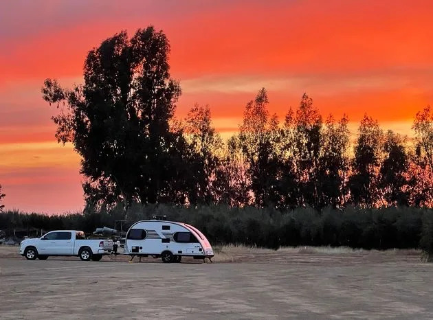 The author and her wife's teardrop trailer and Babbs, their Ram truck, at MoonBeam Farm in Corning, California, in October 2021.