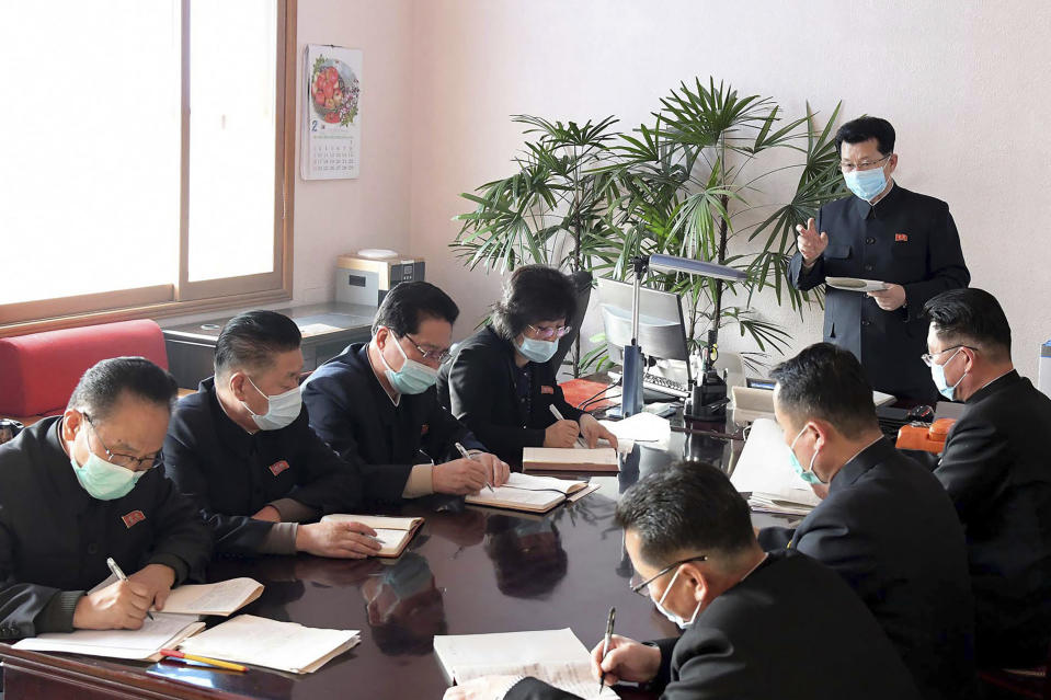 In this undated photo distributed on Wednesday, Feb. 12, 2020, by the North Korean government, North Korean Premier Kim Jae Ryon, right top, has a meeting at the emergency anti-epidemic headquarter in Pyongyang, North Korea. Independent journalists were not given access to cover the event depicted in this image distributed by the North Korean government. The content of this image is as provided and cannot be independently verified. (Korean Central News Agency/Korea News Service via AP)