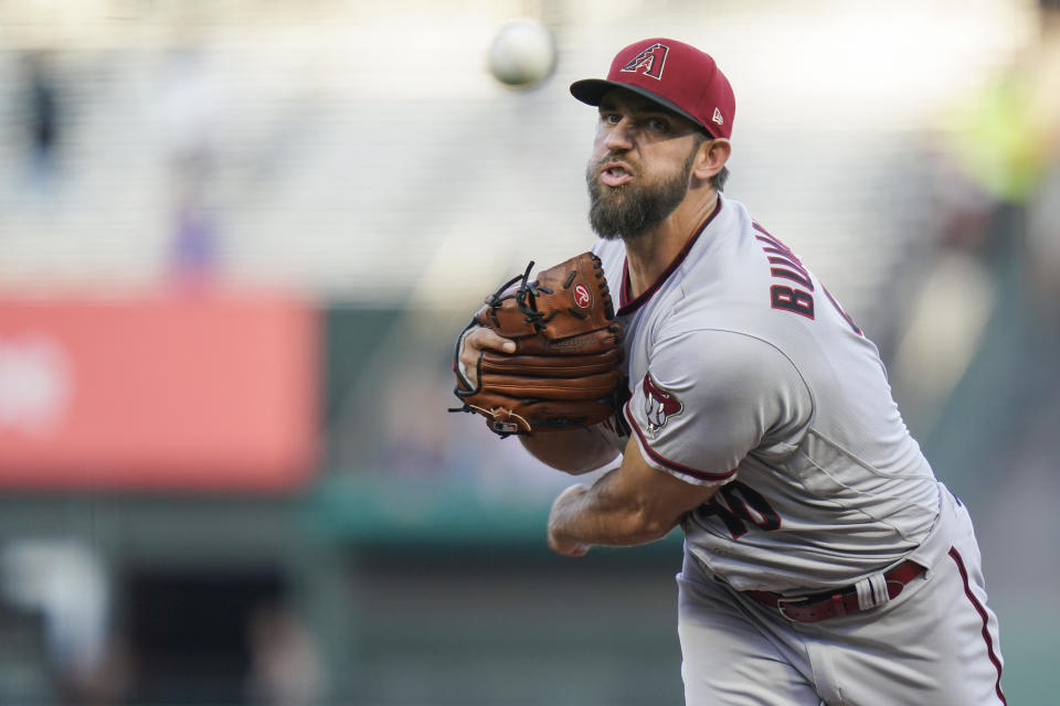 Arizona Diamondbacks' Madison Bumgarner pitches against the San Francisco Giants during the first inning of a baseball game in San Francisco, Monday, Aug. 15, 2022. (AP Photo/Godofredo A. Vásquez)