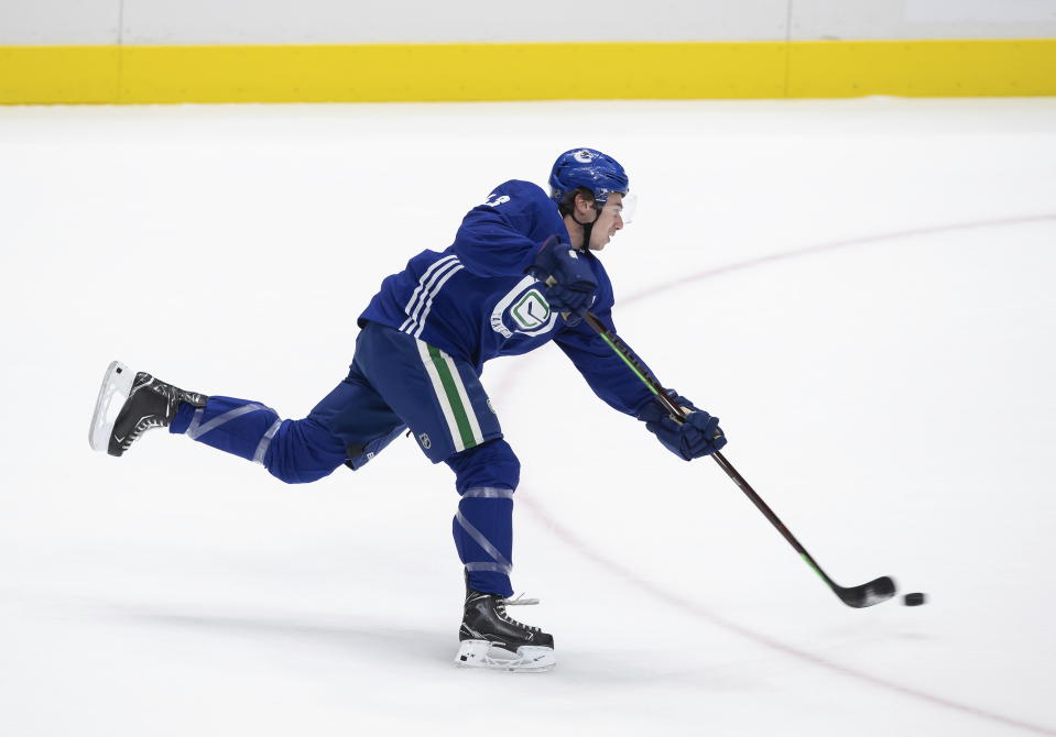 Vancouver Canucks defenceman Quinn Hughes takes a shot on goal during the NHL hockey team's training camp, in Vancouver, Monday, July 13, 2020 (Darryl Dyck/The Canadian Press via AP)