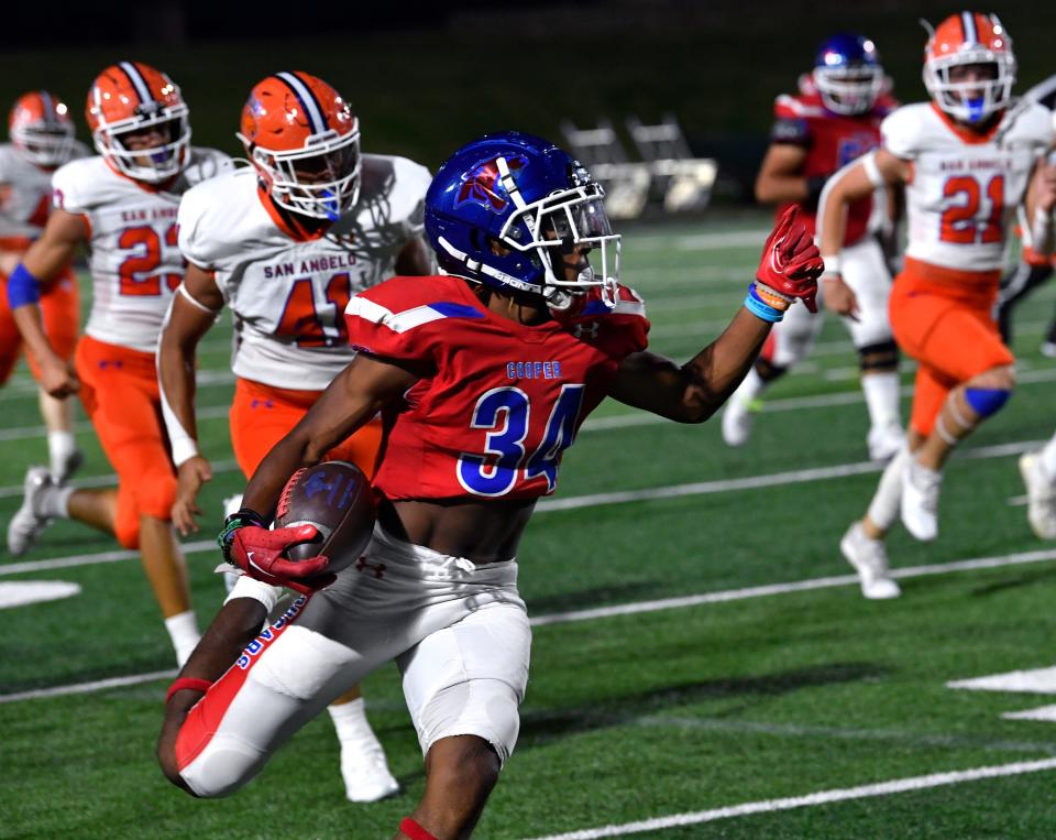 Cooper High School running back Daniel Bray closes the second half of the Cougars' game against San Angelo Central with a 66-yard touchdown run Friday at Shotwell Stadium.