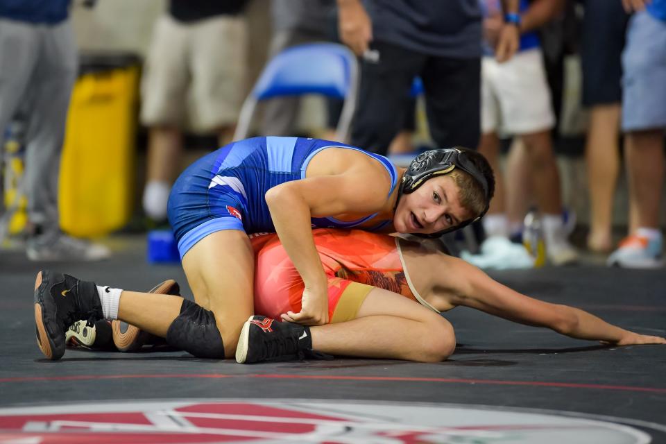 Perry's Lincoln Rohr (top) looks for help from his coaches at the 16U Freestyle National Championships in Fargo, N.D.