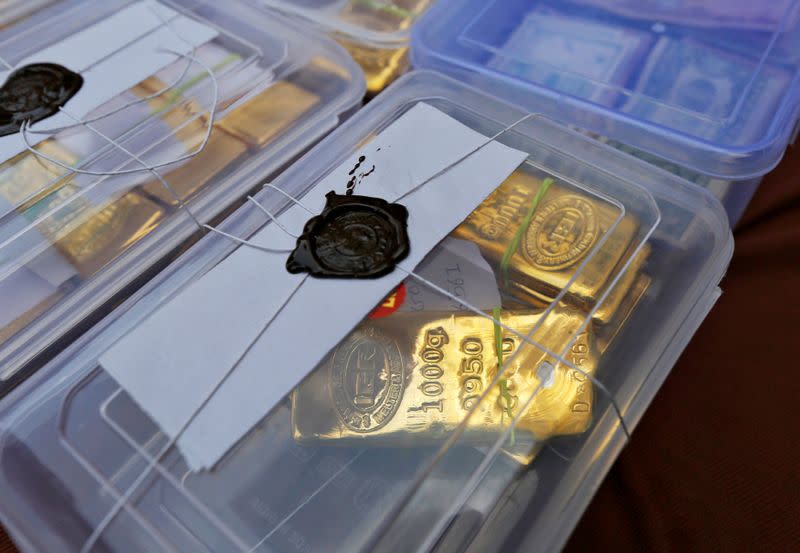 FILE PHOTO: Seized gold bars are kept on display by Indian police officials at a police station in the western Indian city of Ahmedabad
