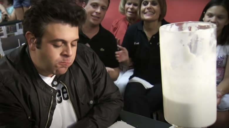 Adam Richman grimacing milkshake