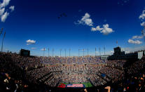 US Air Force F15e Strike Eagles fly over Arthur Ashe Stadium as members of the military unfurl the national flag before the start of the women's singles final match between Serena Williams of the United States and Victoria Azarenka of Belarus on Day Fourteen of the 2012 U.S. Open at the USTA Billie Jean King National Tennis Center on September 9, 2012 in the Flushing neighborhood, of the Queens borough of New York City. (Photo by Chris Trotman/Getty Images for USTA)