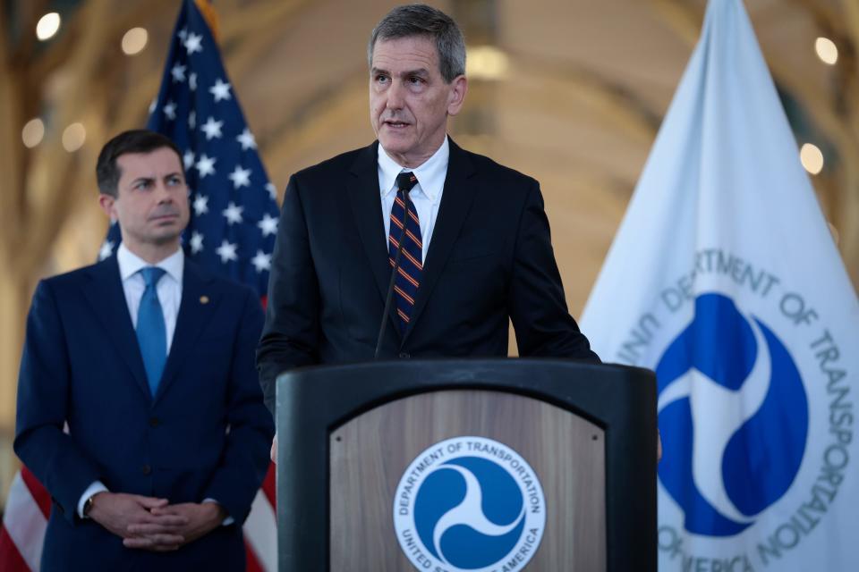 ARLINGTON, VIRGINIA - DECEMBER 19: FAA Administrator Mike Whitaker (R) and U.S. Transportation Secretary Pete Buttigieg (L) speaks during a news conference at Ronald Reagan National Airport December 19, 2023 in Arlington, Virginia.