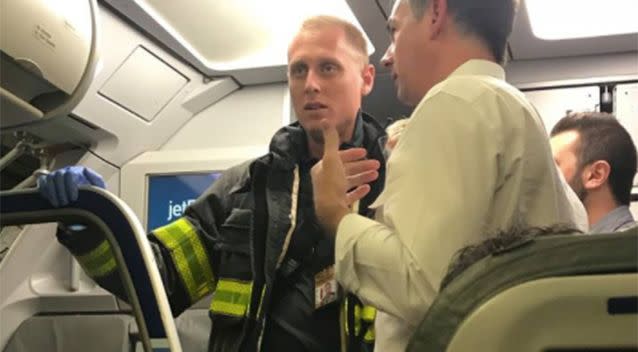Paramedics arrived and the woman was taken to hospital after the plane arrived in Fort Lauderdale Source: Xenia Flanagan/ Facebook